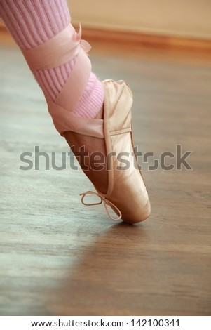 Legs a little ballerina in pointe in ballet poses