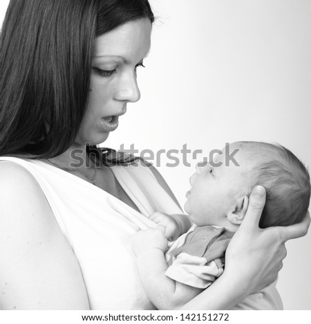 Black and White art image of mother holding baby boy/Tender mother love