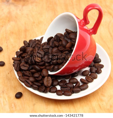 Arabic coffee beans in red ceramic coffee cup