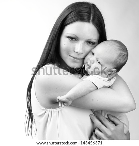 Black and White Art photo of beautiful mother holding baby boy/tender mother love