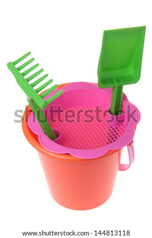 Border of colorful gardening tools : bucket, spade over white background