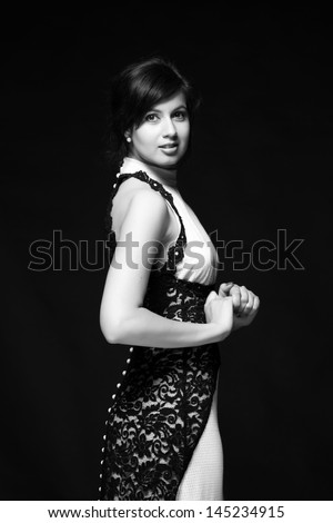 Black and white image of an attractive young woman in a beautiful dress on Beauty and Fashion/Fashion art photo