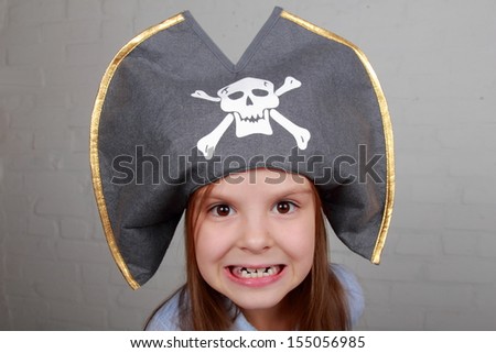 Image of a beautiful young girl in the role of an evil pirate terrible on Holiday