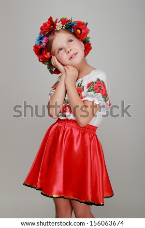 Traditional Ukrainian little girl from east Europe/Emotional little girl in a beautiful Ukrainian costume