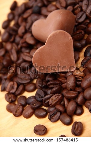 Chocolates in the form of heart with lots of coffee beans