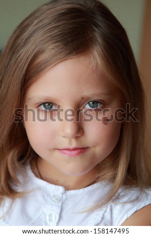 Portrait of beautiful smiling child with healthy hair