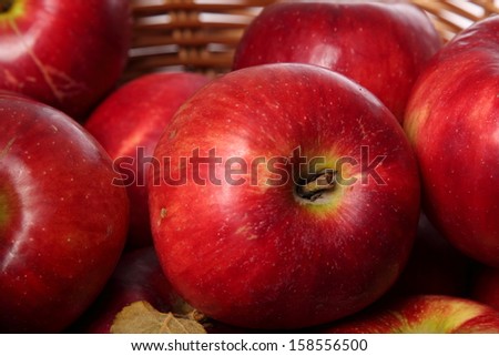 Jonagold apples in a basket on white background