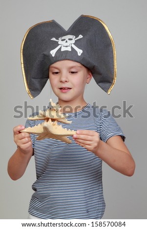 Caucasian cute little child in the costume of the pirate on Holiday