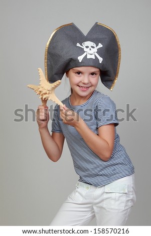 Lovely happy little girl  in the costume of the pirate