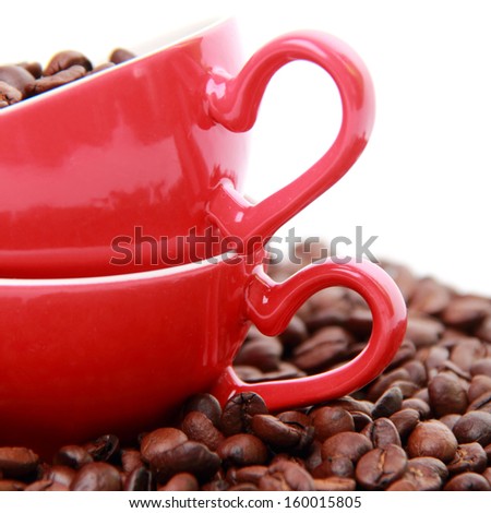 coffee beans in ceramic red coffee cup with heart symbol isolated on Valentine Day