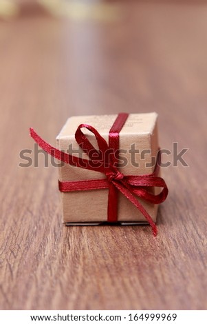 gift box on wooden table over grunge background