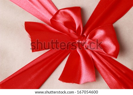 red bow ribbon a gift box on Holiday theme/Wrapped vintage gift box with red ribbon bow