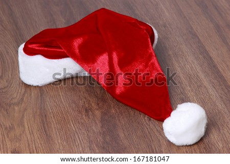 santa hat over wooden background on Holiday theme/Christmas hat over wooden background