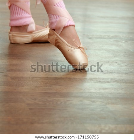 Legs A Little Ballerina In A Pink Ballet Shoes And Socks In Ballet Poses Trains In Ballet Hall On The Floor