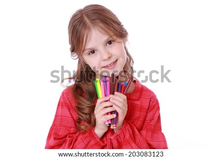 Beautiful little girl holding colorful felt-tip pens isolated on white/European kid with felt-tip pens