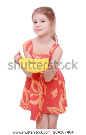Happy cheerful little girl holding yellow bananas/Happy girl holds a bunch of bananas, isolated on white