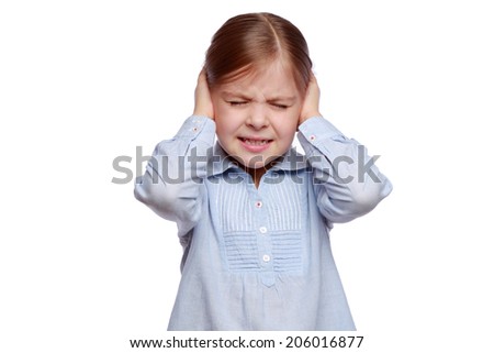 Emotional little girl covered her ears with her hands isolated on white
