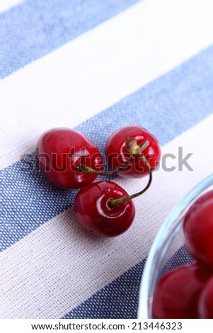 Three natural red cherries with stem