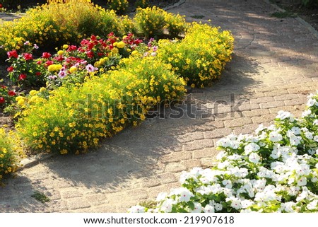 Lush landscaped garden with flower bed and colorful plants