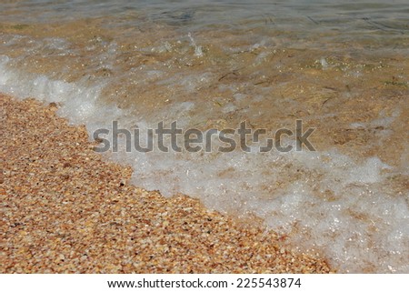 Background of clean sea-water and sand at the bottom