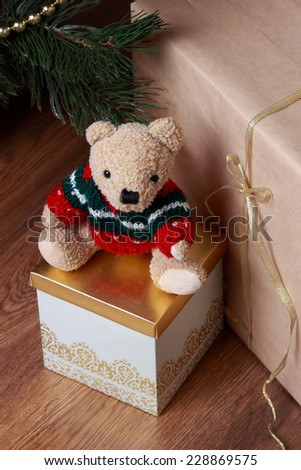 Christmas decoration with antique teddy bear over wooden background on Holiday theme