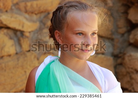 Beautiful elegant girl a Greek-style antique  dreams/Young girl in a role of the Greek goddess of outdoors