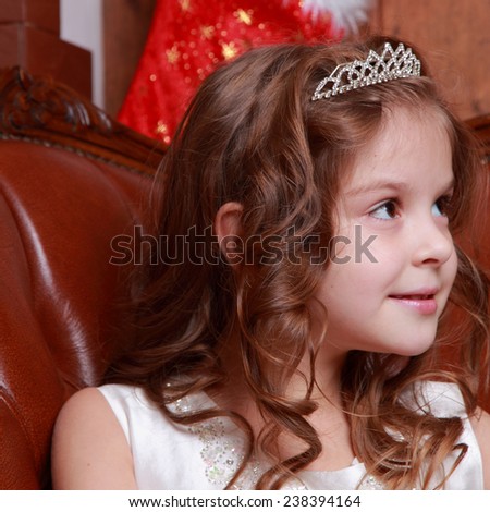 Happy beautiful princess with christmas presents near the fur-tree/Little cute girl on Christmas time