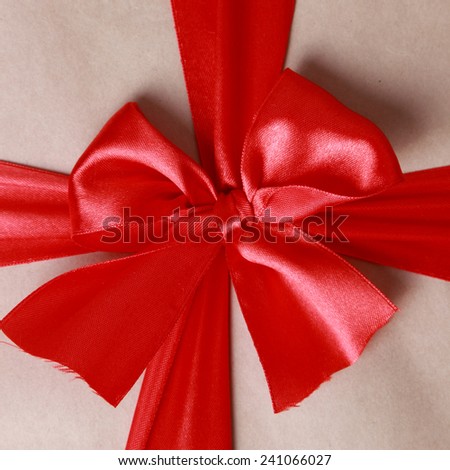 red bow ribbon a gift box on Holiday theme/Wrapped vintage gift box with red ribbon bow