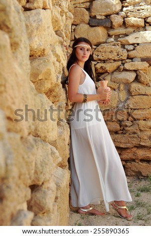 Beautiful fullbody Greek goddess with ancient amphora