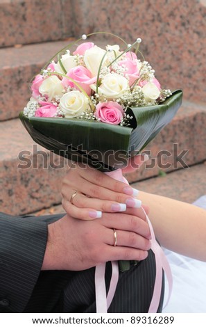 stock photo Loving couple holding hands with wedding rings just married 
