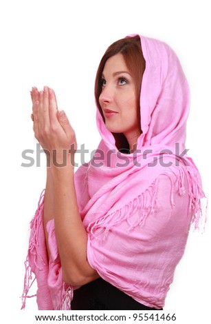 Beautiful young muslim women pray looking up over white background on religion theme/muslim girl prays