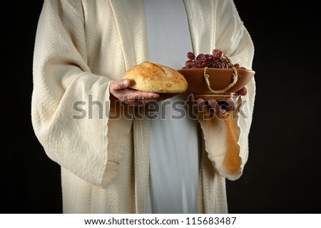 Jesus hands holding bread and grapes, symbols of communion