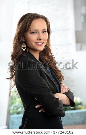 Portrait of beautiful businesswoman smiling inside office building