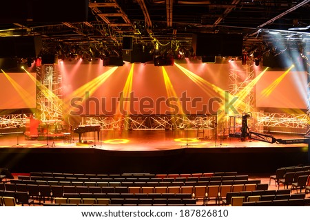 Stage with piano and light beams