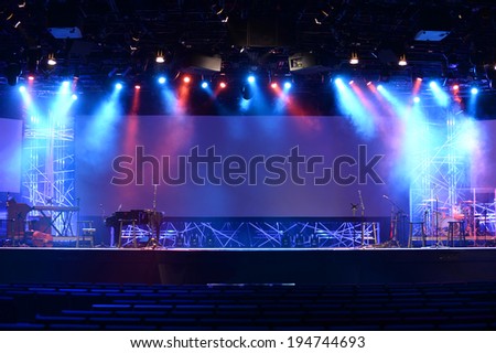 Stage lights before concert with musical instruments