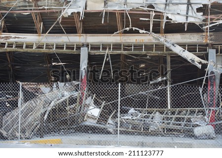 FERGUSON, MO/USA  AUGUST 15, 2014: Destroyed Quick Trip building with protective fence