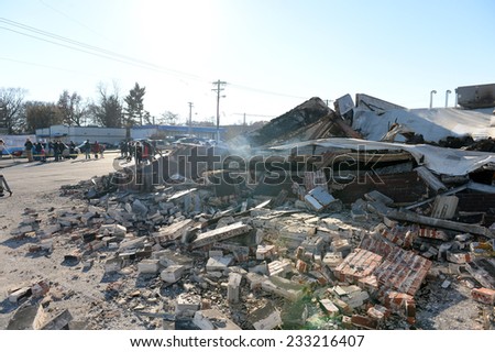 FERGUSON, MO/USA - NOVEMBER 25, 2014: Smoldering remains of Prime Beauty Supply in Ferguson in the aftermath of riots after announcement of Grand Jury decision