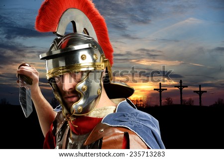 Portrait of Roman soldier brandishing sword with Calvary and crosses at sunset