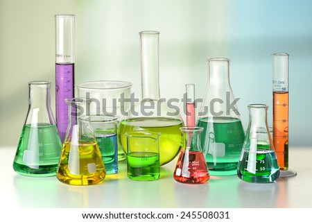 Laboratory glassware on white table and window in background - With Clipping Path on glassware