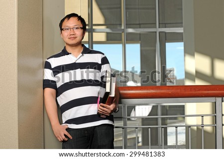 Portrait of asian college student inside building