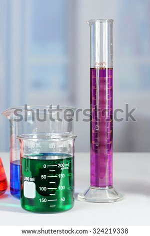 Laboratory beakers and graduated cylinder on lab table