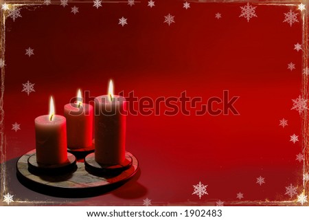 Christmas background with candles and snowflakes over red background.