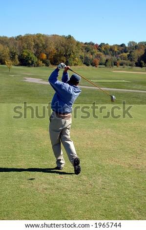 Beautiful golf swing on a pristine fall day.