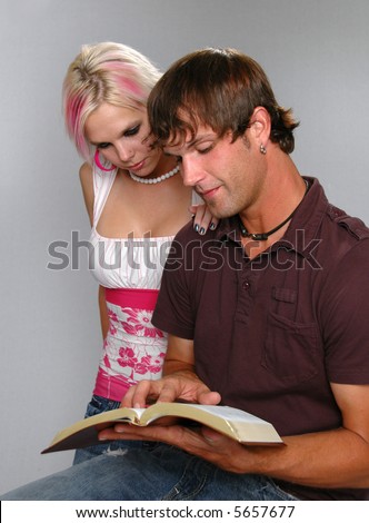 Young couple reading Bible