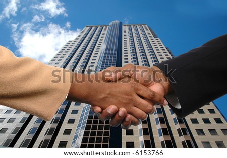 Global agreement depicted by handshake between man and woman