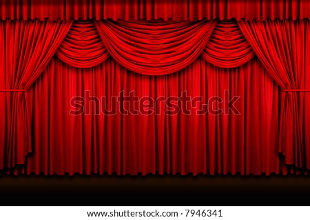 Large red stage curtains over wooden floor