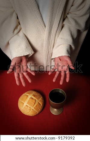 Jesus hands with scars offering the Communion elements of bread and wine