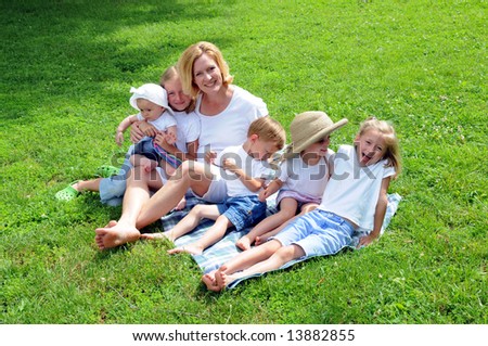 Family laughing together during a sunny day