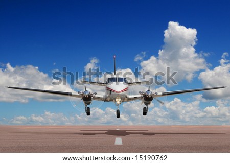 Corporate aircraft landing or taking off during a sunny day
