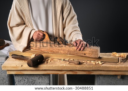 Jesus working with wood plane in carpenter\'s workshop